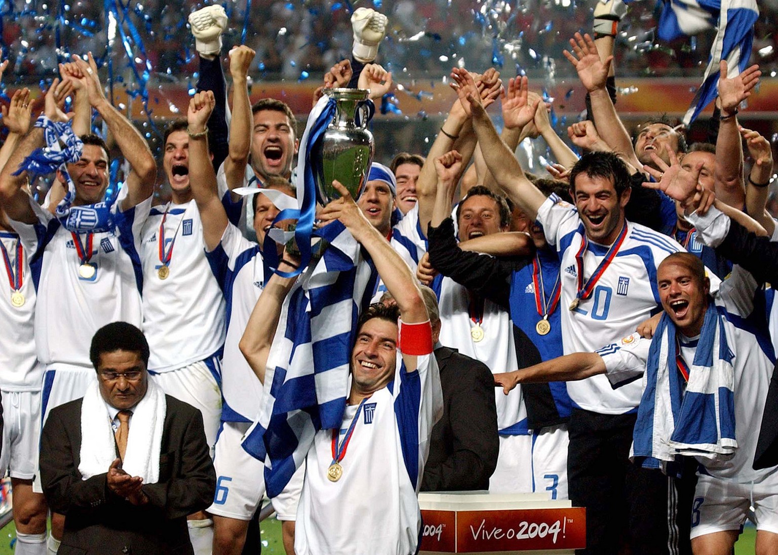 Theodoros Zagorakis of Greece raises the trophy after Greece beat Portugal 1-0 in the Euro 2004 soccer championship final match at the Luz stadium in Lisbon, Portugal, in this Sunday, July 4, 2004 pho ...