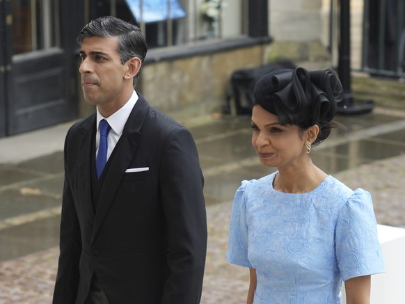 Rishi Sunak and his wife Akshata Murthy, arrive for the Coronation of King Charles III, in London, Saturday, May 6 2023. King Charles III and Camila the Queen Consort, members of the Royal family and  ...