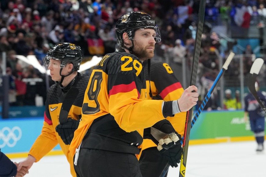 Germany's Leon Draisaitl (29) leaves the ice following a win over France in a men's ice hockey qualification playoff game at the 2026 Winter Olympics, in Milan, Italy, Tuesday, Feb. 17, 2026 ...