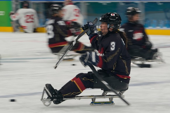 Japan's Akari Fukunishi controls the puck during a warm up prior to the Group A preliminary round hockey match between Japan and Canada at the 2026 Winter Paralympics, in Milan, Italy, Monday, Ma ...