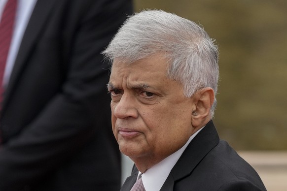 Sri Lankan president Ranil Wickremesinghe inspects a military guard of honour after arriving at the parliamentary complex in Colombo, Sri Lanka, Wednesday, Aug. 3, 2022. (AP Photo/Eranga Jayawardena)
 ...