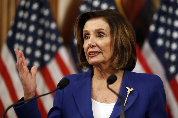 House Speaker Nancy Pelosi of Calif. speaks before she signs the Coronavirus Aid, Relief, and Economic Security (CARES) Act. after it passed in the House on Capitol Hill, Friday, March 27, 2020., in W ...