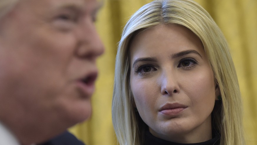 Ivanka Trump, listens as her father President Donald Trump, talks via a video conference to astronauts on the International Space Station, Monday, April 24, 2017, from the Oval Office of the White Hou ...