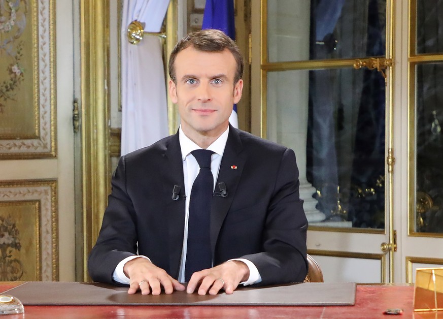epa07222303 French President Emmanuel Macron speaks during a special address to the nation, his first public comments after four weeks of nationwide &#039;yellow vest&#039; (gilet jaune) protests, at  ...