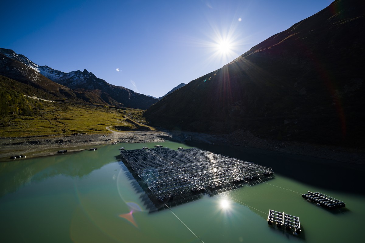 Floating barges with solar panels are pictured on the 'Lac des Toules', an alpine reservoir lake, in Bourg-Saint-Pierre, Switzerland, Tuesday, Oct. 8, 2019. After completion the floating sol ...