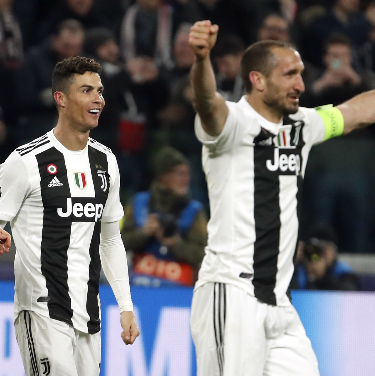 Juventus' Cristiano Ronaldo, center left, and Juventus' Giorgio Chiellini, center right, celebrate at the end of the Champions League round of 16, 2nd leg, soccer match between Juventus and  ...