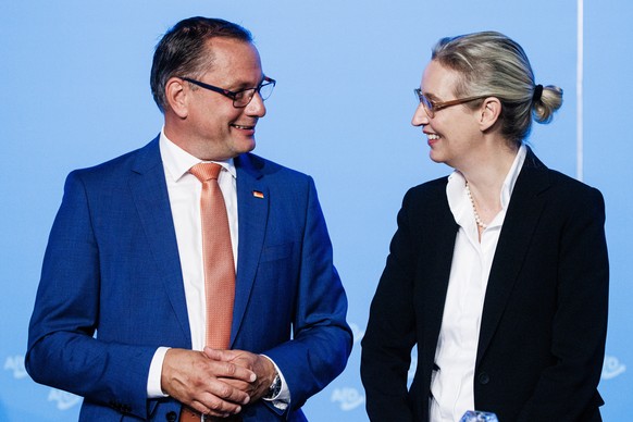 epa10773041 Alternative for Germany (AfD) party co-chairman and spokesman Tino Chrupalla (L) and AfD deputy chairwoman Alice Weidel attend the AfD party convention in Magdeburg, Germany, 28 July 2023. ...