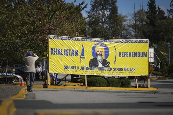 A photo of the late Temple President Hardeep Singh Nijjar is seen on a banner outside the Guru Nanak Sikh Gurdwara Sahib in Surrey, British Columbia, on Monday, September 18, 2023, where Temple President…