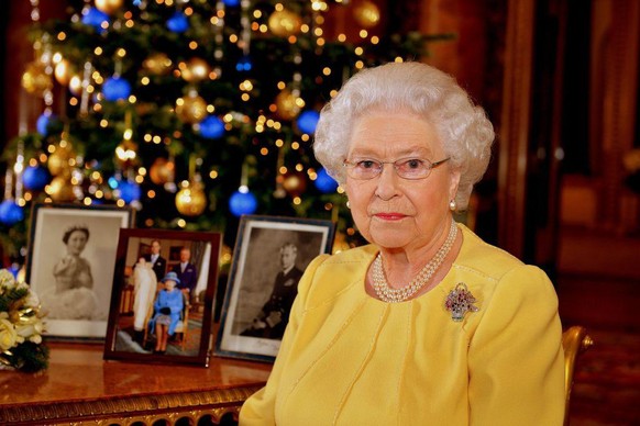 2013 Queen Elizabeth II after recording her Christmas Day broadcast to the Commonwealth, in the Blue Drawing Room at Buckingham Palace in central London. (Photo by John Stillwell/PA Images via Getty I ...
