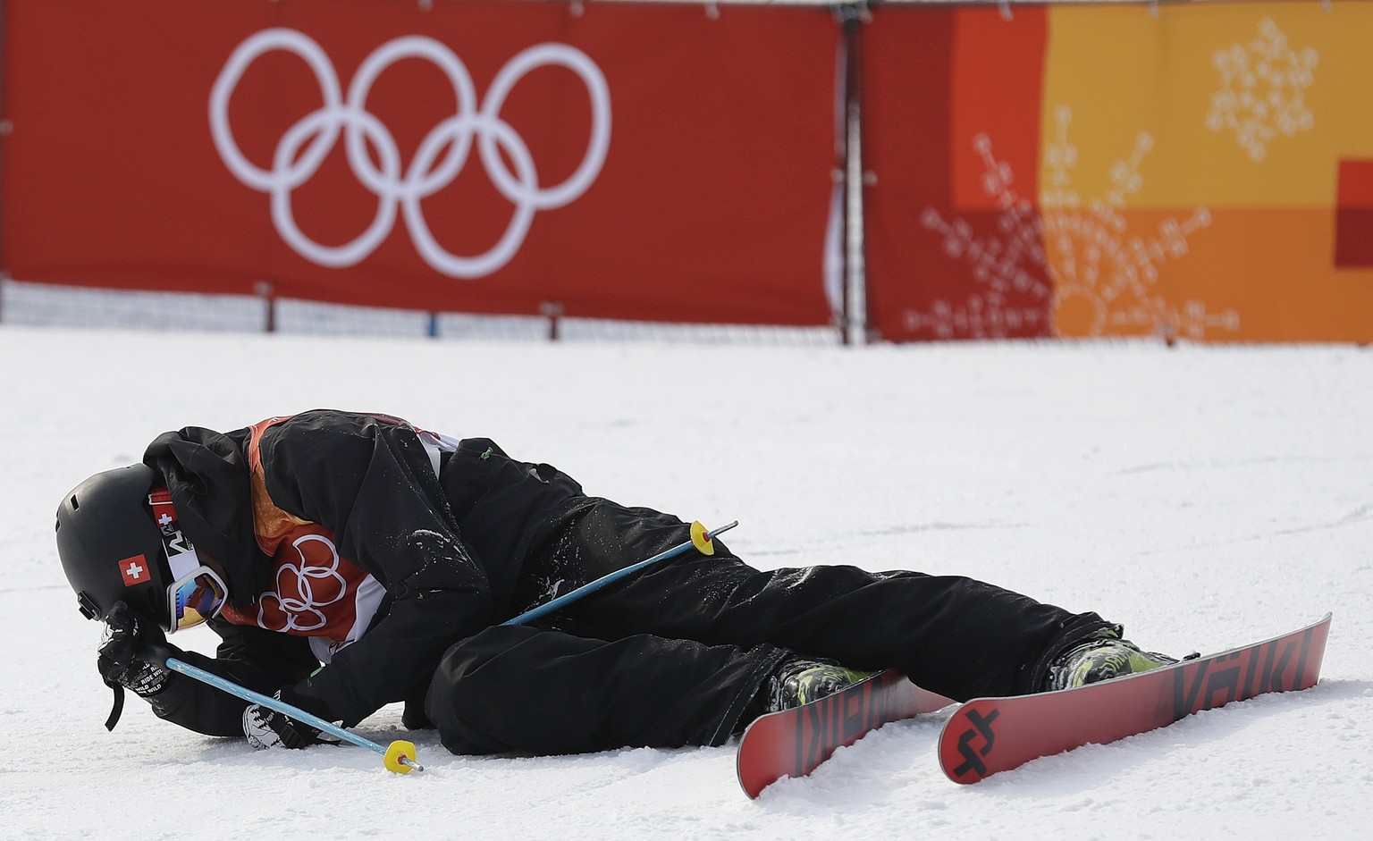 Andri Ragettli, of Switzerland, sits on the course after crashing during the men&#039;s slopestyle final at Phoenix Snow Park at the 2018 Winter Olympics in Pyeongchang, South Korea, Sunday, Feb. 18,  ...