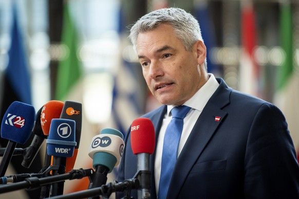 Austria&#039;s Chancellor Karl Nehammer speaks with the media as he arrives for an EU summit in Brussels, Thursday, April 18, 2024. European Union leaders vowed on Wednesday to ramp up sanctions again ...