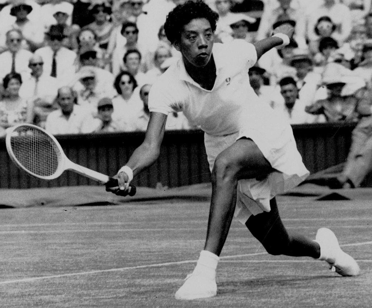 Althea Gibson makes a return to Darlene Hard during their title match at Wimbledon, which Gibson won 6-3, 6-2, in this July 6, 1957, photo. Gibson, a champion tennis player in the 1950s, was the first ...