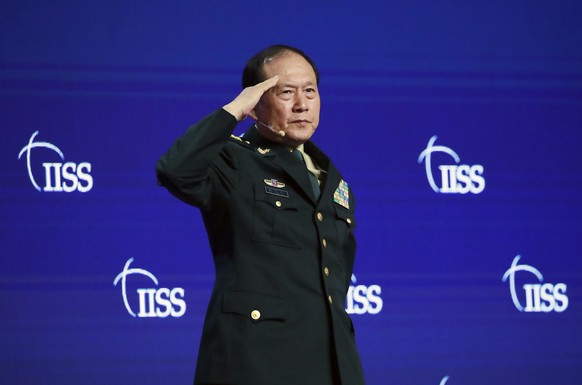 epa12938637 (FILE) - Chinas Minister of National Defense Wei Fenghe salutes during the fifth plenary session of the International Institute for Strategic Studies (IISS) Shangri-la Dialogue at the Sha ...