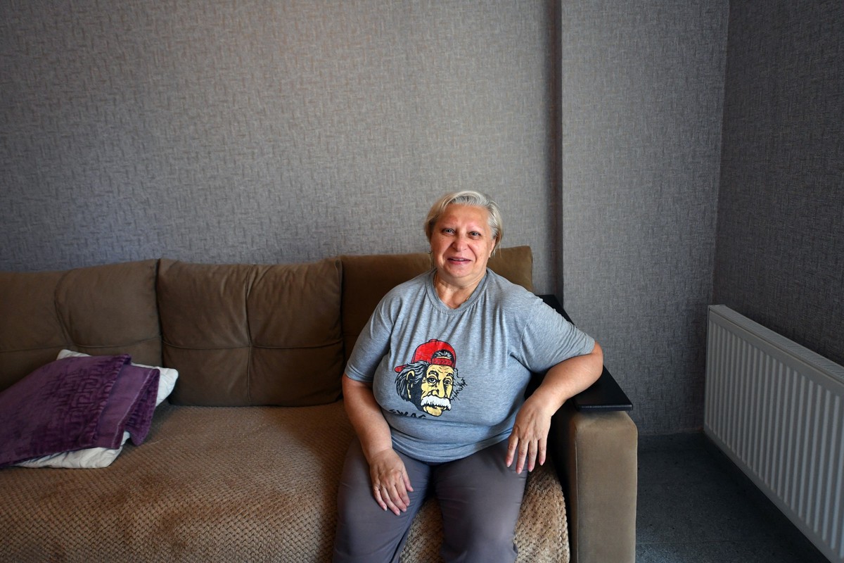 Galina Giller, the 67-year-old pensioner, is seen in her new one-bedroom flat she was given for free by the Moscow-installed authorities in May 2024, in the Russian-controlled Azov Sea port city of Ma ...