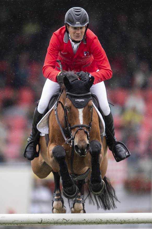 Beat Mandli from Switzerland on Dsarie at the &quot;Longines FEI Jumping Nations Cup of Switzerland&quot; during the CSIO Show Jumping in St. Gallen, Switzerland, Sunday, June 6, 2021. (KEYSTONE/Ennio ...