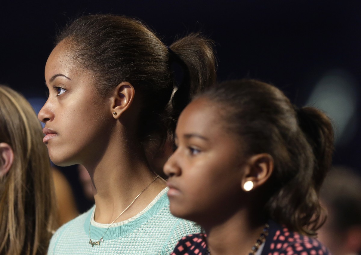 FILE - In this Jan. 19, 2013, file photo, Malia Obama, left, and her sister, Sasha Obama, right, listen during the Kids' Inaugural: Our Children. Our Future." event in Washington. Malia is a ...