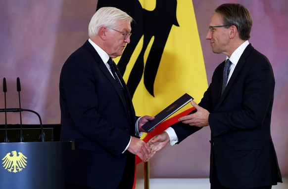 epa11707368 Germany&#039;s newly appointed Finance Minister Joerg Kukies (R) receives his certificate of appointment from German President Frank-Walter Steinmeier at Bellevue Palace in Berlin, Germany ...