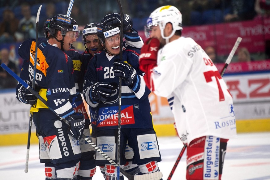 Ambri&#039;s players celebrate the 2-2 goal during the preliminary round game of National League Swiss Championship 2023/24 between, HC Ambri Piotta against Rapperswil-Jona Lakers at the Gottardo Aren ...