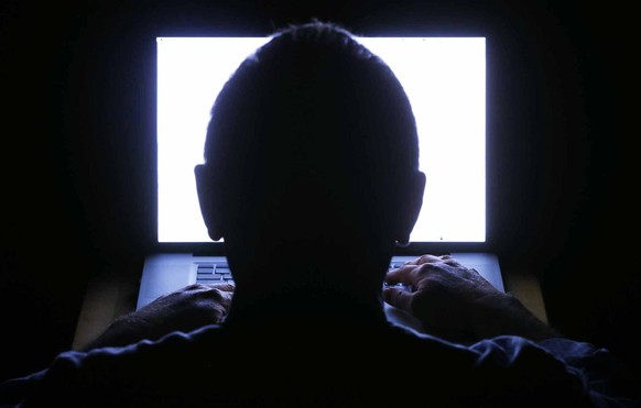 Photo illustration to accompany story on online pornography and its effect on marriages. (John Albert/Wichita Eagle/Tribune News Service via Getty Images)

anonym anonymous computer laptop dark room w ...