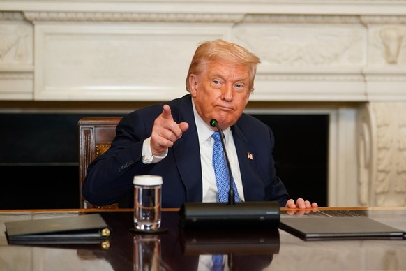 epa12290512 US President Donald Trump attends a signing ceremony in the State Dining Room of the White House in Washington, DC, USA, 08 August 2025. US President Trump said he would host the leaders o ...