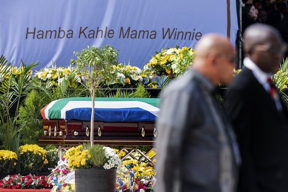 epa06668941 The coffin of Winnie Madikizela-Mandela stands in front of the words in Xhosa &#039;Go well mother Winnie&#039; during the official state funeral at Orlando stadium in Soweto, Johannesburg ...