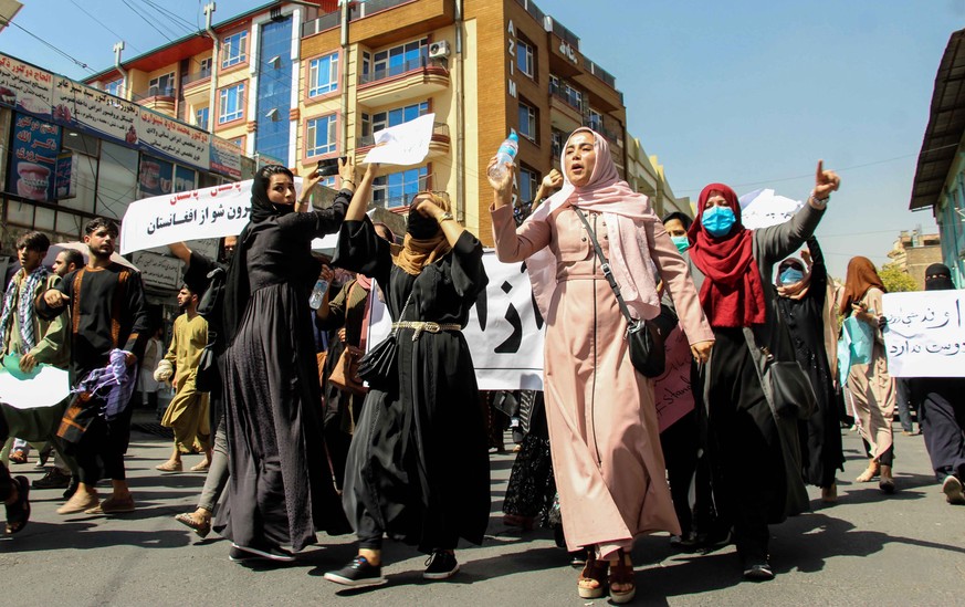 epa09452991 Afghans hold placards shouting anti-Pakistan slogans during a protest in Kabul, Afghanistan, 07 September 2021.The demonstrations began after Ahmad Massoud, leading the National Resistance ...