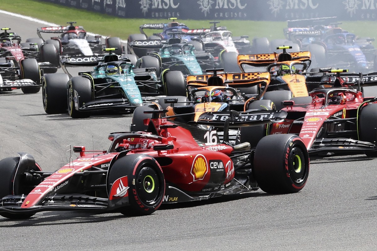 Ferrari driver Charles Leclerc of Monaco, McLaren driver Oscar Piastri of Australia and Ferrari driver Carlos Sainz of Spain steer into the first corner during the Formula One Grand Prix at the Spa-Fr ...