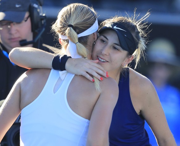 epa07274628 Belinda Bencic of Switzerland (R) congratulates Anna Karolina Schmiedlova of Slovakia after their semifinal match at the Hobart International tennis tournament at Domain Tennis Centre in H ...