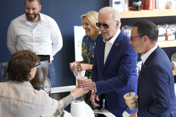 Pennsylvania Gov. Josh Shapiro, from right, President Joe Biden and first lady Jill Biden visit Denim Coffee after a campaign event in Harrisburg, Pa., on Sunday, July 7, 2024. (AP Photo/Manuel Balce  ...