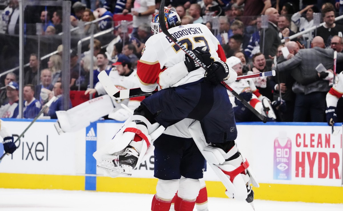 Florida Panthers goaltender Sergei Bobrovsky (72) and defenseman Brandon Montour (62) celebrate after defeating the Toronto Maple Leafs in overtime of Game 5 of an NHL hockey Stanley Cup second-round  ...