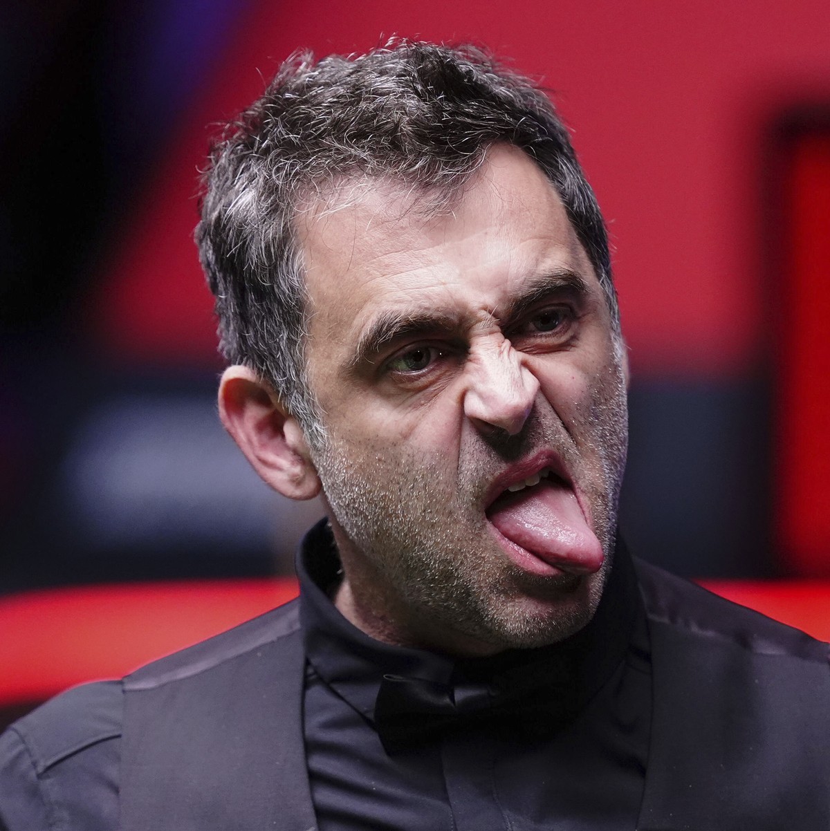 Ronnie O'Sullivan reacts during his match with Zhao Xintong on day fourteen of the Halo World Snooker Championship at the Crucible Theatre, Sheffield, England, Friday May 2, 2025. (Mike Egerton/P ...
