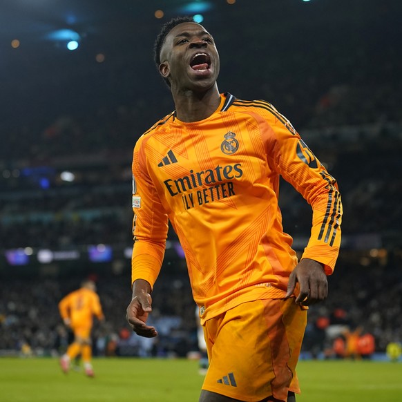 Real Madrid&#039;s Vinicius Junior celebrates after his teammate Real Madrid&#039;s Brahim Diaz scored their side second goal during the Champions League playoff first leg soccer match between Manches ...