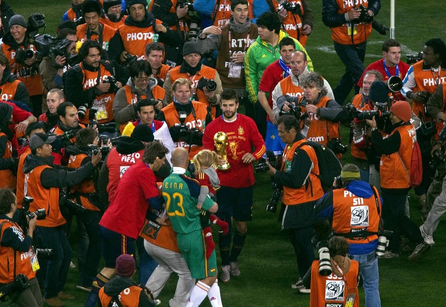 Mandatory Credit: Photo by Back Page Images/Shutterstock 1206333ad Gerard Pique of Spain celebrates with the World Cup trophy after winning against Netherlands Netherlands v Spain, 2010 FIFA World Cup ...