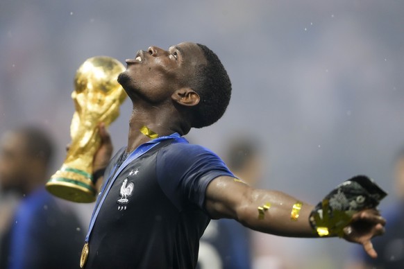 France&#039;s Paul Pogba celebrates with the trophy after the final match between France and Croatia at the 2018 soccer World Cup in the Luzhniki Stadium in Moscow, Russia, Sunday, July 15, 2018. (AP  ...