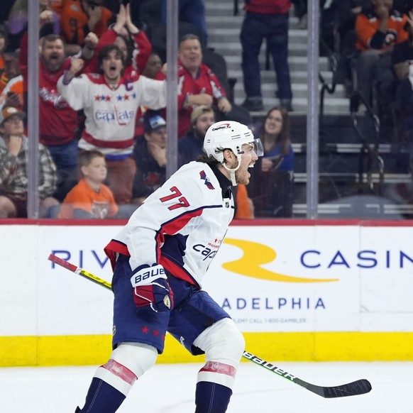 Washington Capitals&#039; T.J. Oshie, left, celebrates after scoring a goal during the third second period of an NHL hockey game against the Philadelphia Flyers, Tuesday, April 16, 2024, in Philadelph ...