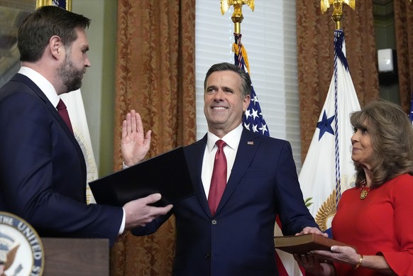 Vice President JD Vance swears in John Ratcliffe as CIA Director as his wife Michele holds the Bible in the Vice Presidential ceremonial office in the Eisenhower Executive Office Building on the White ...