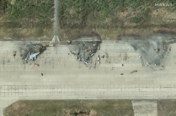epa12155285 A handout satellite image made available by Maxar Technologies shows aircrafts destroyed following a series of Ukrainian drone strikes at the Olenya Airbase in Russia, 04 June 2025. Ukrain ...