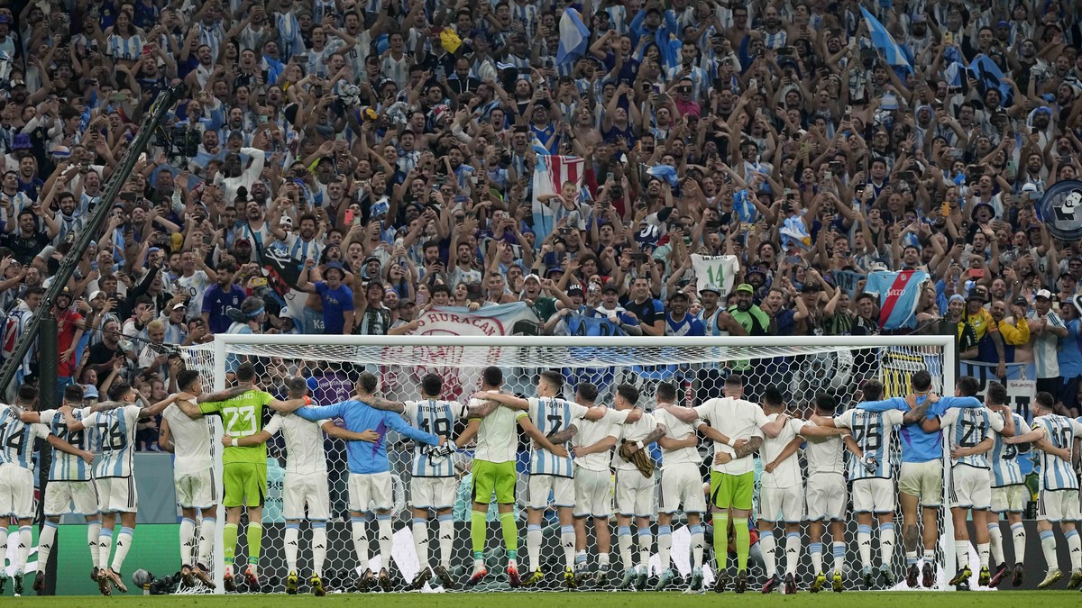 Team Argentina celebrate with supporters after the World Cup semifinal soccer match between Argentina and Croatia at the Lusail Stadium in Lusail, Qatar, Tuesday, Dec. 13, 2022. (AP Photo/Martin Meiss ...