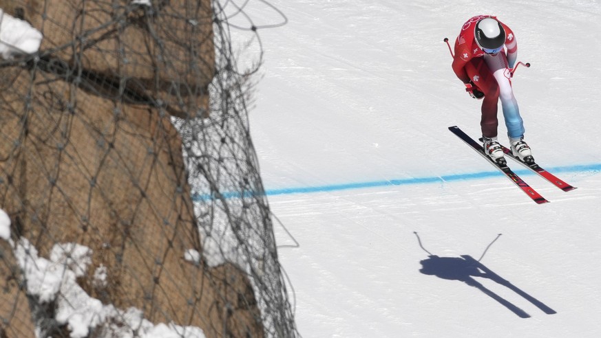 Michelle Gisin, of Switzerland makes a jump during women&#039;s downhill training at the 2022 Winter Olympics, Monday, Feb. 14, 2022, in the Yanqing district of Beijing. (AP Photo/Luca Bruno)