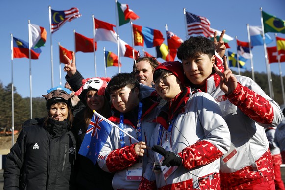 Members of the New Zealand Olympic Team pose for a photograph with volunteers after a welcome ceremony inside the Pyeongchang Olympic Village prior to the 2018 Winter Olympics in Pyeongchang, South Ko ...