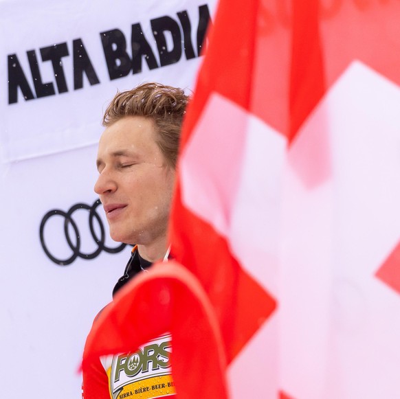 epa11789808 Winner Marco Odermatt of Switzerland celebrates on the podium after the Men's Giant Slalom race at the FIS Alpine Skiing World Cup event in Alta Badia, Italy, 22 December 2024. EPA/AN ...