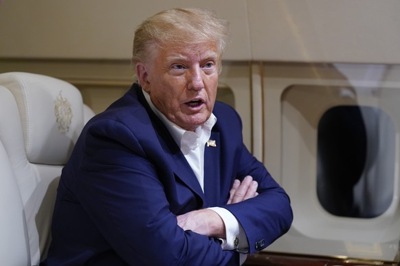 Former President Donald Trump speaks to reporters in flight on his plane after a campaign rally at Waco Regional Airport, in Waco, Texas, Saturday, March 25, 2023, while en route to West Palm…