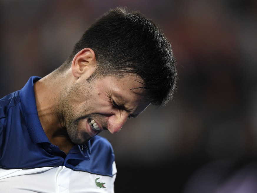 Serbia&#039;s Novak Djokovic grimaces during his fourth round match against South Korea&#039;s Chung Hyeon at the Australian Open tennis championships in Melbourne, Australia, Monday, Jan. 22, 2018. ( ...