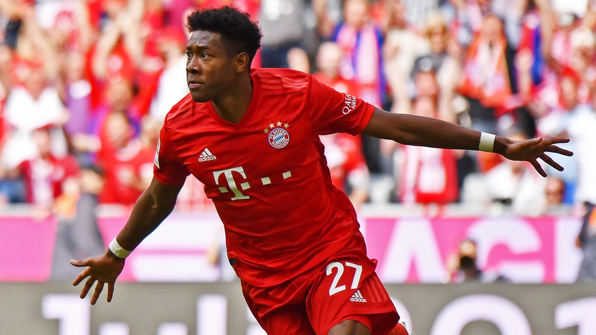 epa07581281 Bayern's David Alaba (L) celebrates after scoring the 2-1 lead during the German Bundesliga soccer match between FC Bayern Munich and Eintracht Frankfurt in Munich, Germany, 18 May 20 ...