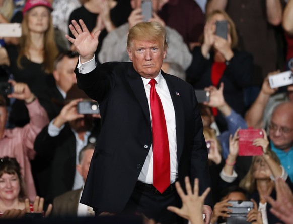 President Donald Trump waves after speaking at a campaign rally Friday, Oct. 19, 2018, in Mesa, Ariz. Trump is in Arizona stumping for Senate candidate Martha McSally. (AP Photo/Matt York)