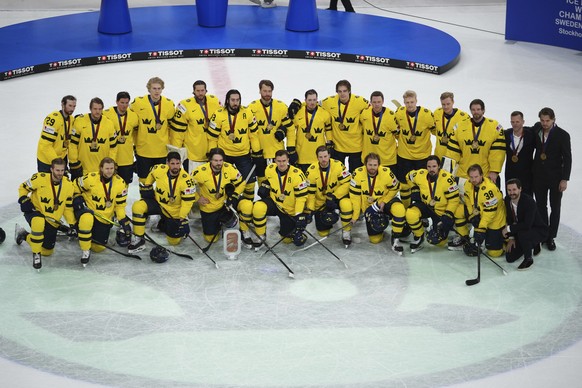 Sweden&#039;s players pose after winning the bronze medal match between Denmark and Sweden at the ice hockey world championships in Stockholm, Sweden, Sunday, May 25, 2025. (AP Photo/Petr David Josek) ...