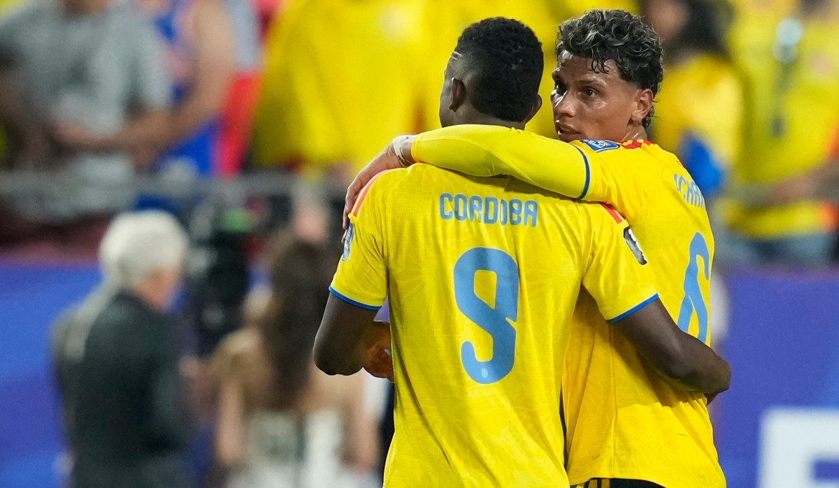 Colombia's Jhon Cordoba (9) and Colombia's Richard Rios (6) celebrate their team victory at the end of the World Cup round of 32 soccer match between Colombia and Ghana in Kansas City, Mo.,  ...