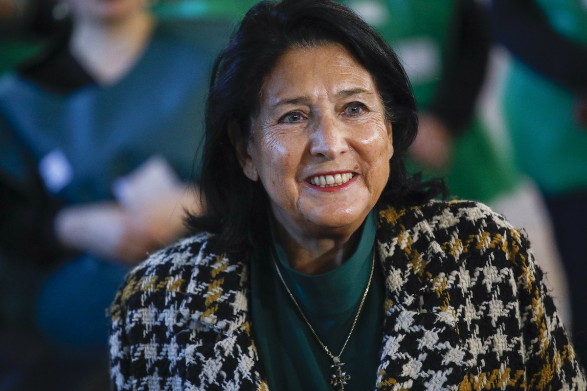 epa11684078 Georgian President Salome Zourabichvili smiles at a polling station during parliamentary elections in Tbilisi, Georgia, 26 October 2024. A total of 18 parties are participating in the parl ...