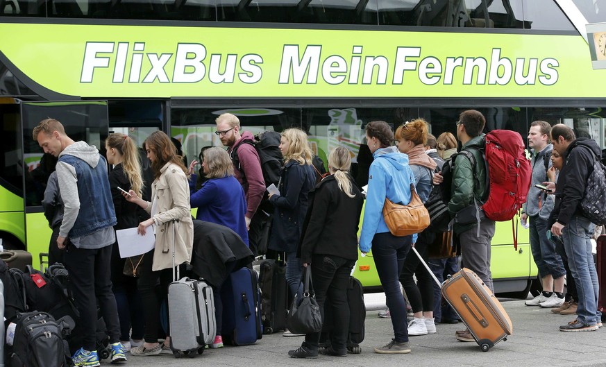 Passengers board a bus of &#039;FlixBus&#039; coach operator at the main bus station (ZOB) during a strike of train drivers&#039; union GDL in Berlin, Germany, May 20, 2015. Freight services in German ...