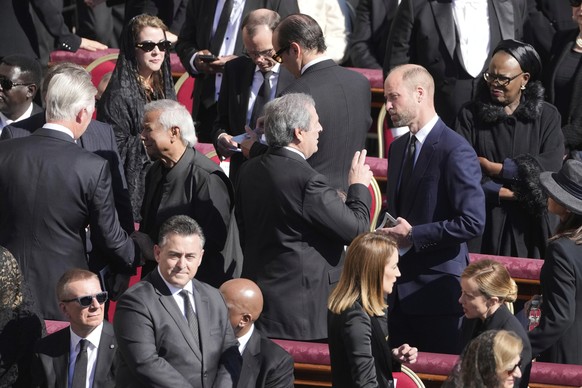 Britain&#039;s Prince William, center right, speaks with guests as he arrives for the funeral of Pope Francis in St. Peter&#039;s Square at the Vatican, Saturday, April 26, 2025. (AP Photo/Markus Schr ...